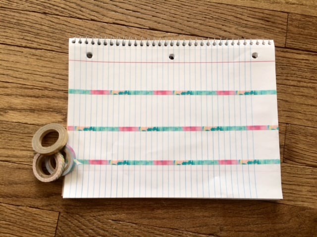 washi tape across the spiral notebook horizontally