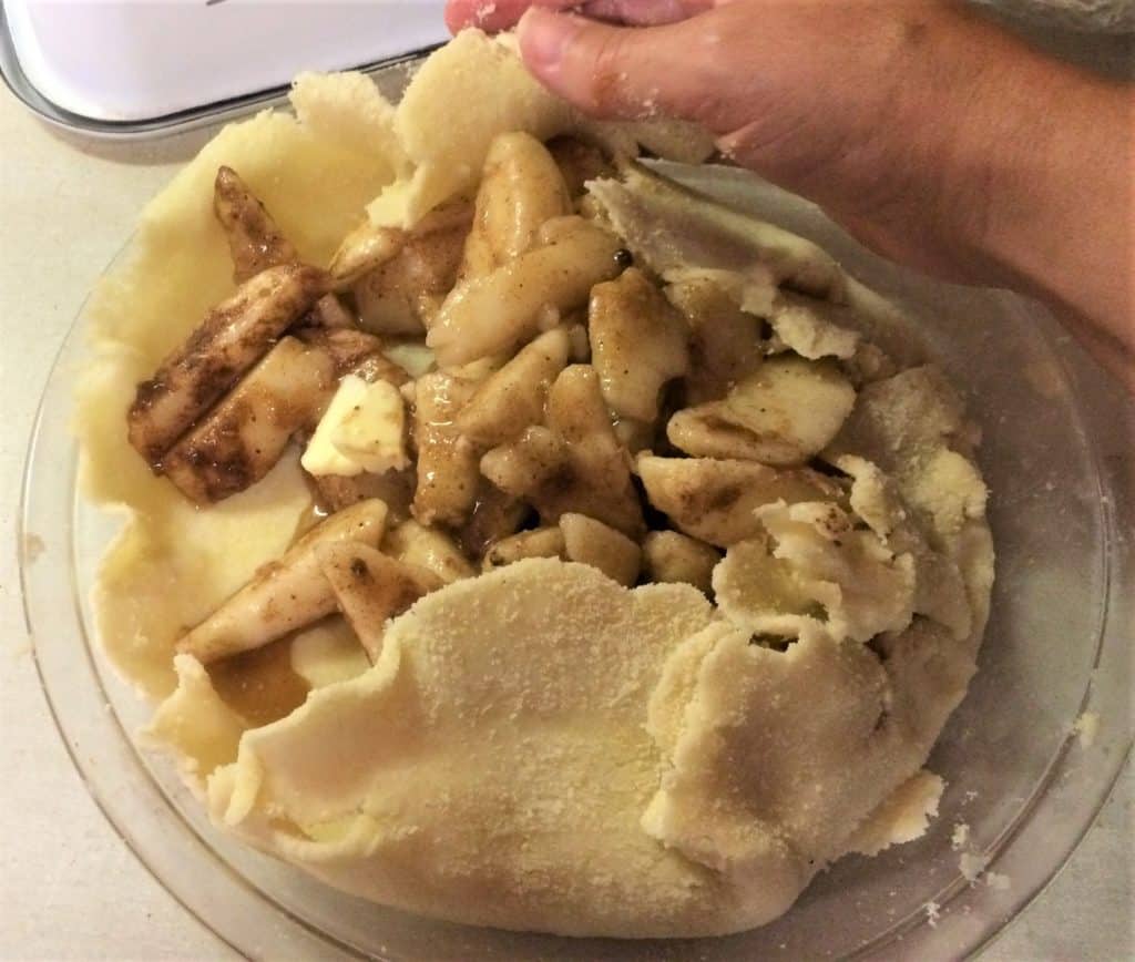 Roughly fold over crust on top of the pear mixture in your pear tart