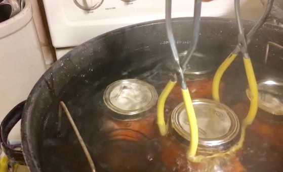 Using canning tongs