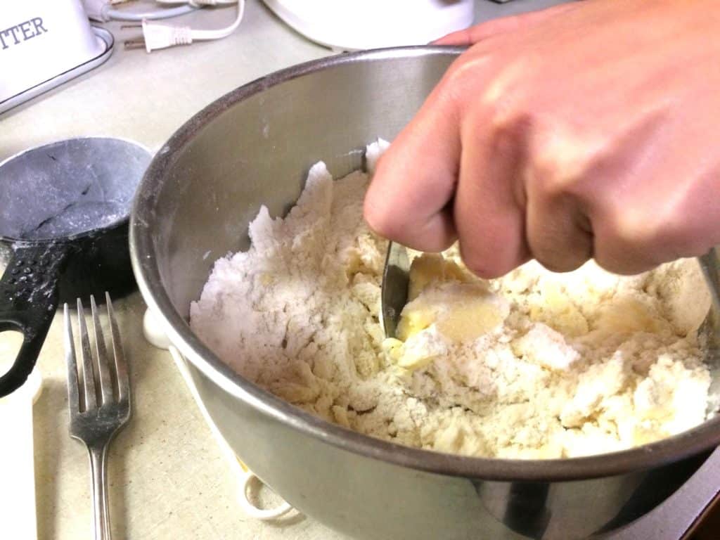 Cutting the butter into the biscuit dough