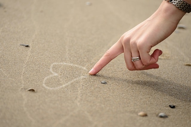 Drawing in the sand.  The path of forgiveness.
