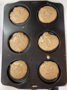 dough in English muffin pan