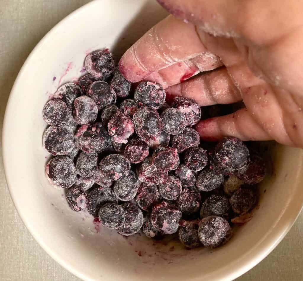 flour coated blueberries