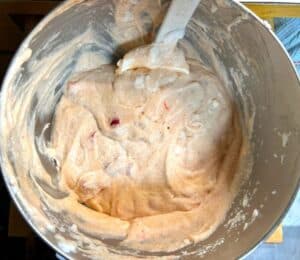 folded in egg whites to cupcake batter