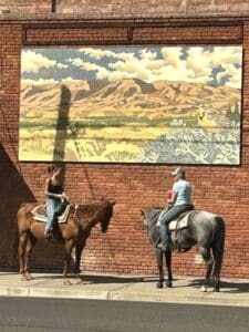 two horses with riders