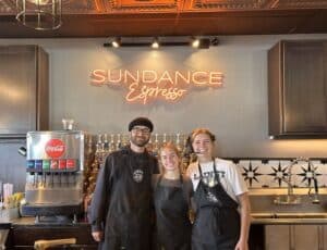 Neon sign and staff in front
