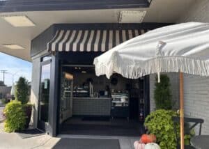 striped awning and outdoor umbrella