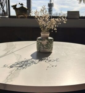 vase on a table with  shadow